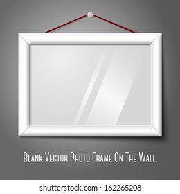 Vector white isolated horizontal photo frame hanging on the wall, with glass.