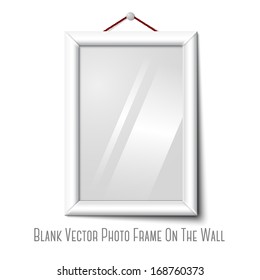 Vector white isolated vertical photo frame hanging on the white wall, with glass. 