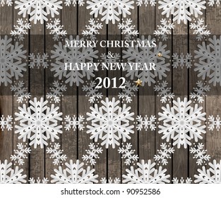 Vector white paper christmas snowflake seamless ornament on a wood background