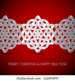 Vector white paper christmas snowflakes on a red background