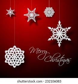 Vector white paper christmas snowflakes on a red background