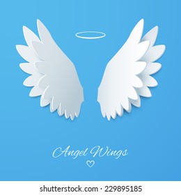 Vector white paper wings on a blue matte background. Beautiful applique. Abstract design. Vector illustration.