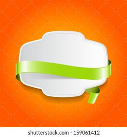 Vector white plastic badge with green silky ribbon over orange background