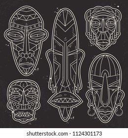 Vector, white silhouette, set of African Ethnic Tribal masks, tattoo.