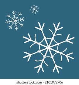 A vector of white snowflakes on the blue background