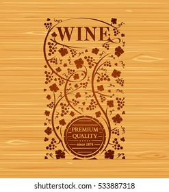 Vector wine emblem with grape bunches and grape leaves on a wooden background