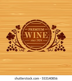 Vector wine emblem with grape bunches and grape leaves on a wooden background
