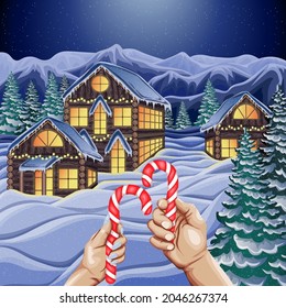 Vector winter card illustration. Landscape with a snowy village with wooden houses in a coniferous forest in the mountains. Two hands with Christmas candies