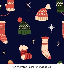 Vector winter Christmas socks, hats and gloves seamless pattern. Hand painted accessories with winter ornament. Cozy cute flat premade wallpaper, wrapping paper, background texture