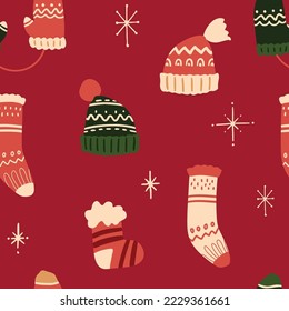 Vector winter Christmas socks, hats and gloves seamless pattern. Hand painted accessories with winter ornament. Cozy cute flat premade wallpaper, wrapping paper, background texture