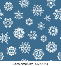 Vector winter illustration in blue colors. Hand drawn abstract snowflakes seamless. Template for cover, poster, t-shirt or fabric.