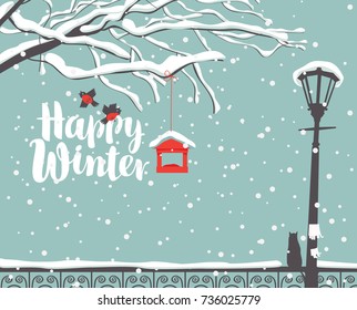 Vector winter scene at the snow-covered park with calligraphic inscription Happy Winter, with branches of a tree, bullfinches and a bird feeder, a street lamp and a cat on the fence in the snow