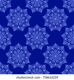 Vector winter seamless pattern. Blue holiday background with snowflakes. Wrapping paper texture, greeting card backdrop