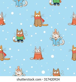 Vector winter seamless pattern with cute cartoon cats and snowflakes on a blue  background.