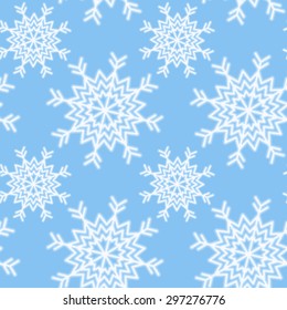 Vector winter seamless pattern of white snowflakes on a blue background. Vector eps 10.