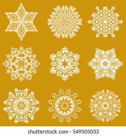 Vector winter snowflake collection on a yellow background. Abstract set of 9 snowflakes with floral elements.