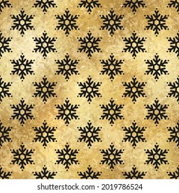 Vector Winter Snowflakes Golden Seamless Pattern. Christmas hand drawn snow print on shiny gold foil background. New year luxury texture for print, wrapping paper, design, decor, gift, backgrounds.