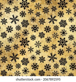 Vector Winter Snowflakes Golden Seamless Pattern. Christmas hand drawn snow print on shiny yellow gold foil background. New year luxury texture for print, wrapping paper, decor, gift, backgrounds.