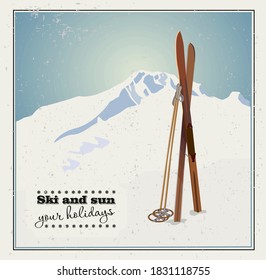 Vector winter themed template with wooden old fashioned skis and poles in the snow with snowy mountains and clear sky on background. Retro looking minimalistic skiing promotion poster template