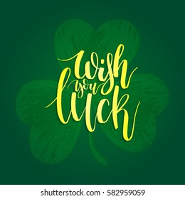 Vector Wish You Luck hand lettering greetings card or poster design. Sketched illustration of irish shamrock symbol with ornate calligraphy. Festive Saint Patrick's Day typography on green background.
