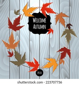 Vector wood texture with multicolor foliage. Grunge background. Retro wooden fence. Colorful maple leaves. Realistic wallpaper eco pattern. Leaf isolated on vintage backdrop. Welcome Autumn. 