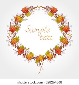 Vector wreath of autumn colored leaves, branches and berries. In red and brown colors. Gradient used.