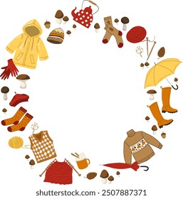 Vector wreath with autumn elements. Fall season clothes, rainy weather stuff: umbrella, socks, sweater, raincoat, rubber boots and mushrooms.