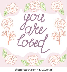 Vector written by hand -"you are loved" text doodles with floral decor