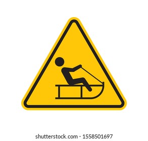 Vector yellow triangle sign - black silhouette figure sledding. Isolated on white background.