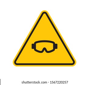 Vector yellow triangle sign - black silhouette ski goggles. Isolated on white background.