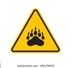 Vector yellow triangle sign - black silhouette beast footprint. Isolated on white background.
