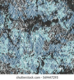 Vector zebra pattern over bright blue watercolor splashes. Bold hand drawn chevron pattern for sport fashion with animal motifs. Seamless modern grunge striped background with zigzag lines and stripes