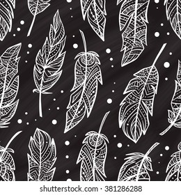 Vector zendoodle feathers seamless pattern on a chalkboard background. Boho style.