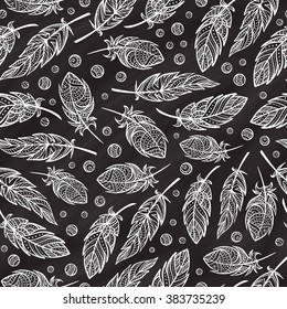 Vector zendoodle feathers seamless pattern on a chalkboard background. Boho style.