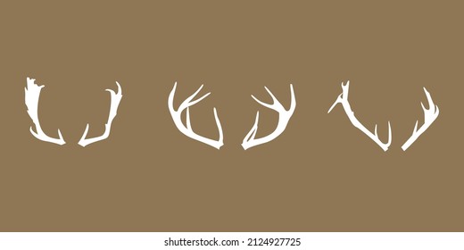 Vectorized deer antlers icons, vector illustration of deer isolated on brown background.