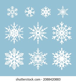 Vectors set of white snowflakes isolated on a blue background.