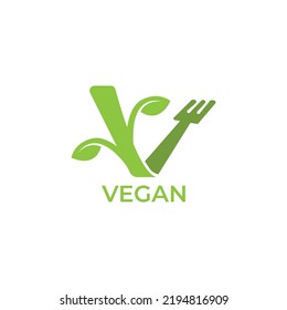 Vegan calligraphy logo with green leaves for organic food. Vegan vegetarian design symbol typography logo