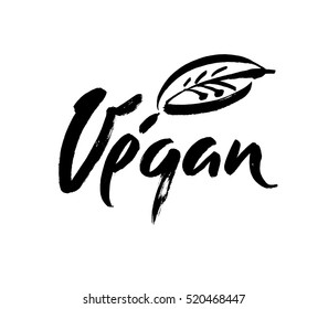Vegan hand written calligraphy lettering with leaf for cafe menu design. Brush lettering Element for labels, logos, badges. Vegan menu. Vector illustration.