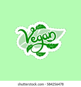 Vegan hand written calligraphy lettering with foliage. Vector eco, organic, bio logos or signs. Vegetarianism, raw, healthy food badges, tag for cafe, restaurants, products packaging etc.