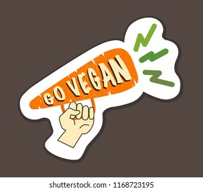 Vegan Inspirational poster with hand and carrot as megaron. Go Vegan. For T-shirts, bags, badges, stickers, menu. Hand draw.