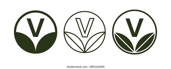 Vegan label with leaves and letter V inside circle. Vegan symbol. Organic, eco product label. Natural, healthy food icon. Vegetarian food symbol. Vector illustration