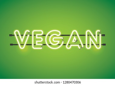 Vegan neon florescent lighting message on a green background