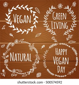 Vegan product label. World vegan day. Hand drawn rustic frame with flowers and leaves on wood background. Typography design. Vegan.