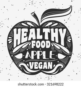 Vegan typographic print with apple. Vegan. Healthy food.  Can be used as a print on T-shirts and bags, label, restaurant menu and shop of organic food. Hand drawn. Inspirational eco poster.