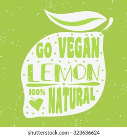 Vegan typographic print with lemon. Go vegan. 100% natural. Can be used as a print on T-shirts and bags, label, restaurant menu and shop of organic food. Hand draw. Inspirational eco poster.