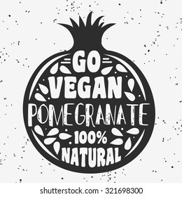 Vegan typographic print with pomegranate. Go vegan. 100% natural. Can be used as a print on T-shirts and bags, label, restaurant menu and shop of organic food. Hand draw. Inspirational eco poster.