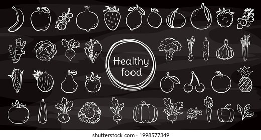 Vegetable and fruit sketch on chalkboard. Chalk on blackboard. Beet, pineapple, pomegranate and cherry. Strawberry, banana and mandarin. Cabbage, eggplant, tomato and carrot