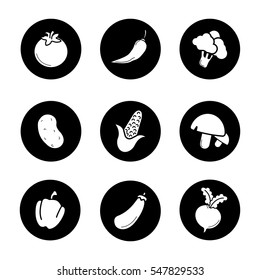 Vegetables icons set. Tomato, hot chili pepper, broccoli, potato, corn, mushrooms, beetroot, paprika, eggplant, maize, turnip. Vector white silhouettes illustrations in black circles