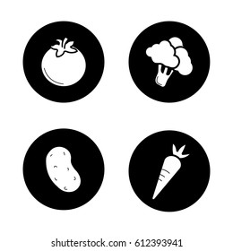 Vegetables icons set. Tomato, potato, broccoli, carrot. Vector white silhouettes illustrations in black circles