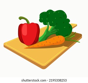 Las verduras están en la tabla de corte. Pimienta, zanahoria, brócoli. Plano.